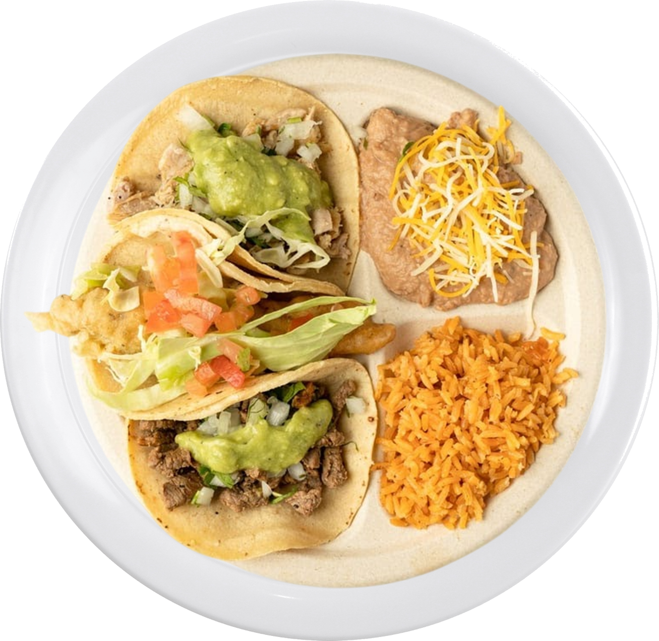 A plate with three tacos topped with guacamole, lettuce, and tomatoes, served with refried beans topped with cheese and a side of Mexican rice.