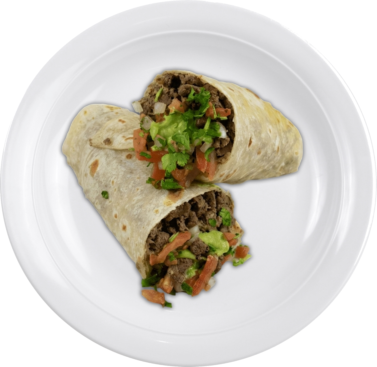 A burrito cut in half is placed on a white plate against a black background. It is filled with beef, chopped tomatoes, onions, and fresh cilantro